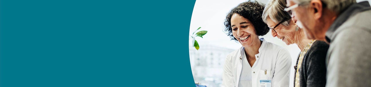 Female physician withs enior couple.