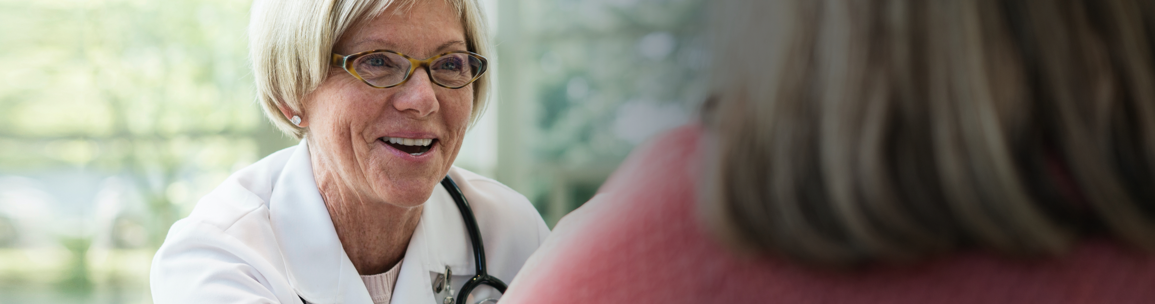 Female doctor reassuring patient