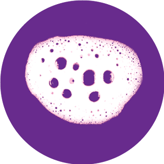 White foam with bubbles on purple circle background